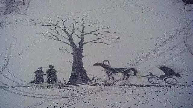 Художник рисует на снегу